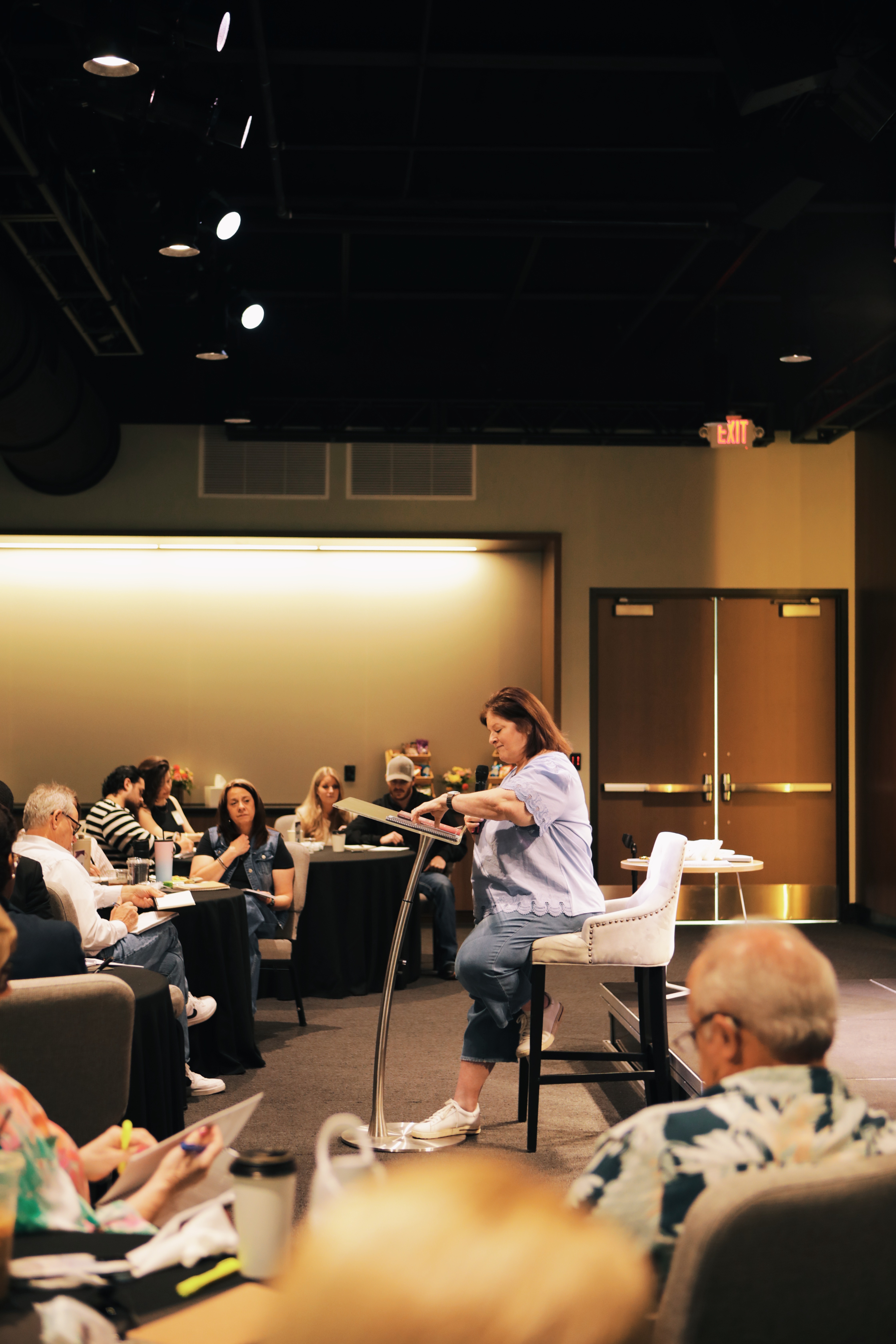 A speaker at an XO Marriage MICT event educating a new group.